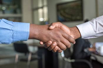 sales people shaking hands