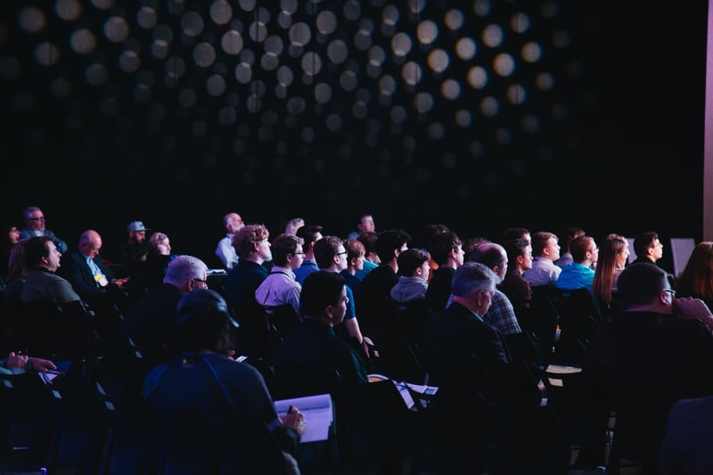 people attending a conference
