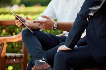 business professionals holding tablet